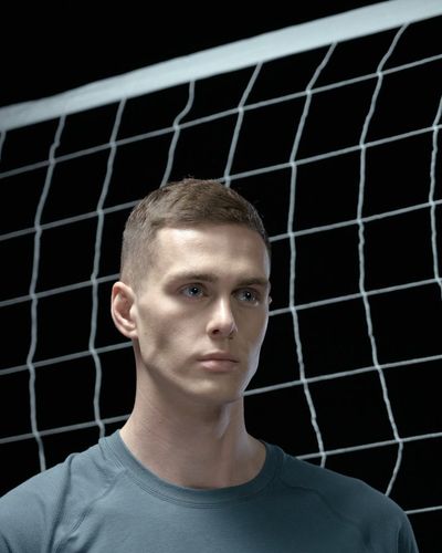 Close-up of a person's focused expression during exercise.